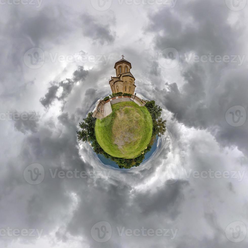 little planet transformation of spherical panorama 360 degrees. Spherical abstract aerial view  near sameba church georgia. Curvature of space. photo