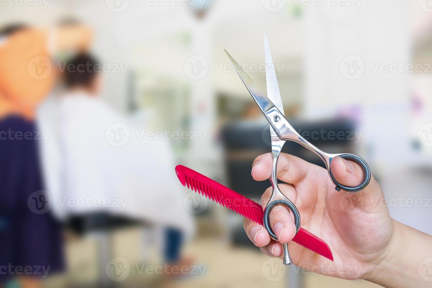 Hairdresser hold scissors with salon beauty background photo
