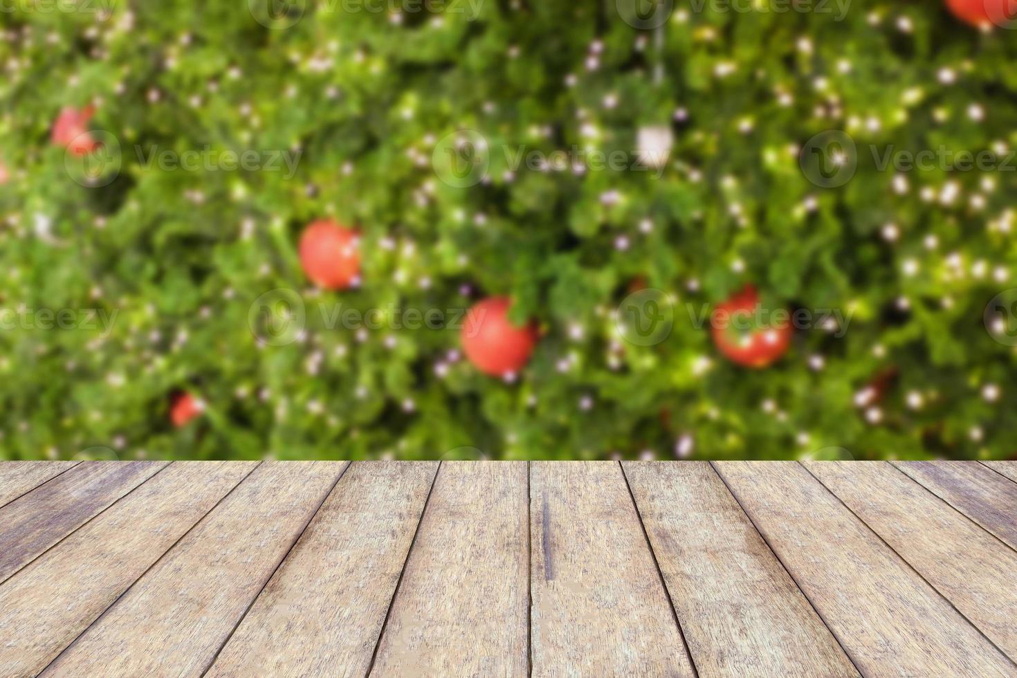 wood floor with decorations on the Christmas tree photo