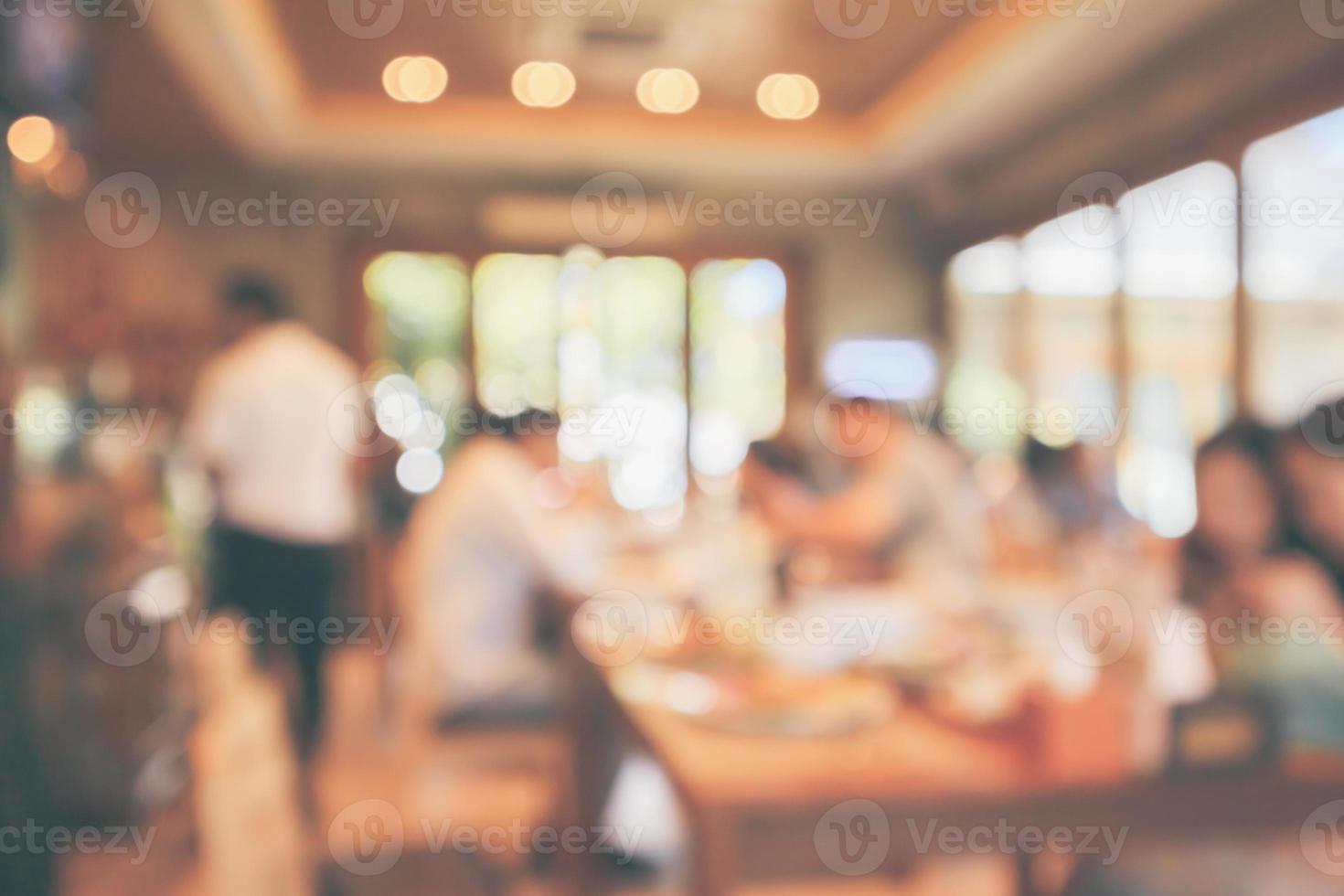 Restaurant cafe or coffee shop interior with customer blur abstract vintage style bokeh light for montage product display background photo