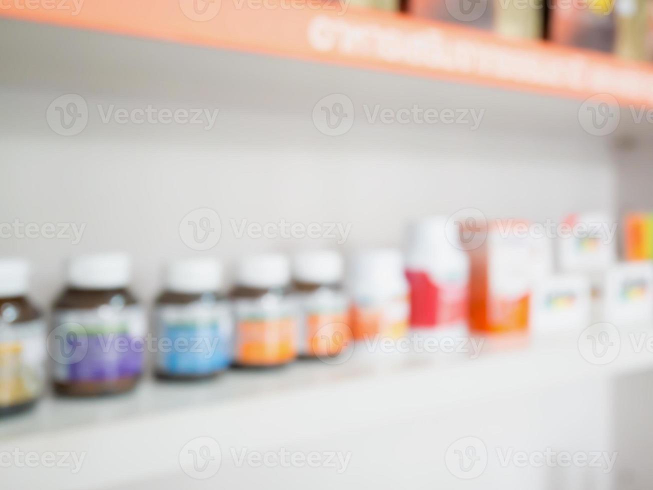 Close up of medicine bottles on shelves of drugs in the pharmacy photo