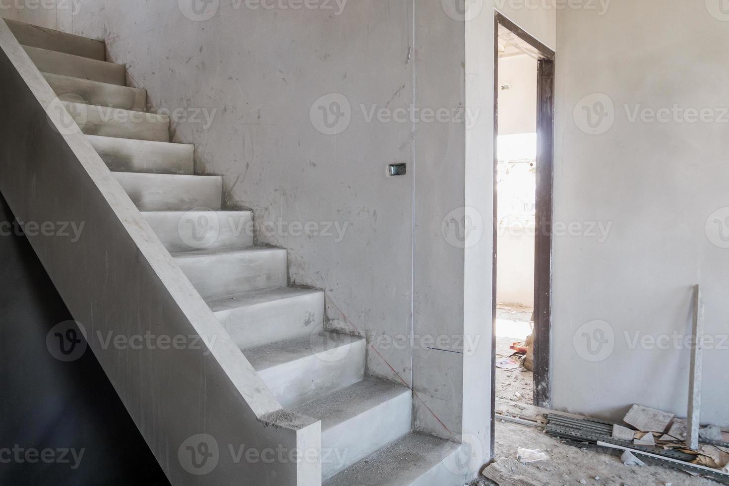 cement concrete stair in the under construction house at building site photo