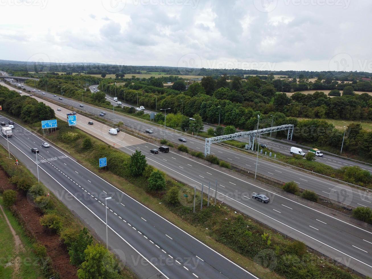 High Angle View of British Motorways with Traffic. The Aerial footage of British Roads and Motorways at between M1 Junction 7 and 9 at Sunset. The Footage captured on 09-07-2022 with drone's camera photo