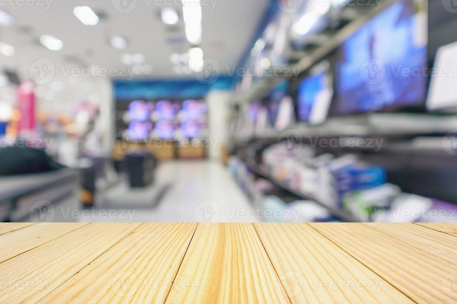 Los grandes almacenes electrónicos muestran televisión y electrodomésticos con fondo borroso de luz bokeh foto