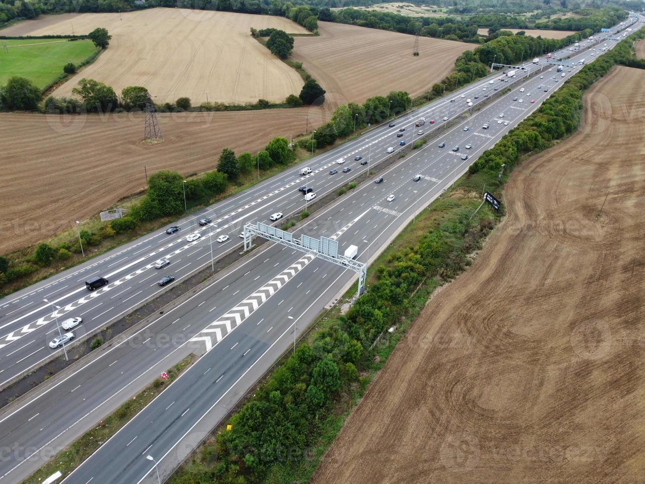 High Angle View of British Motorways with Traffic. The Aerial footage of British Roads and Motorways at between M1 Junction 7 and 9 at Sunset. The Footage captured on 09-07-2022 with drone's camera photo
