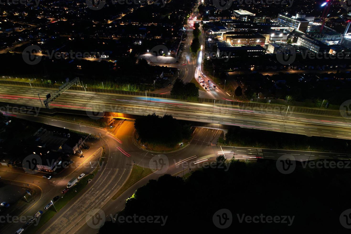 High Angle View of British Motorways with Traffic. The Aerial footage of British Roads and Motorways at between M1 Junction 7 and 9 at Sunset. The Footage captured on 09-07-2022 with drone's camera photo
