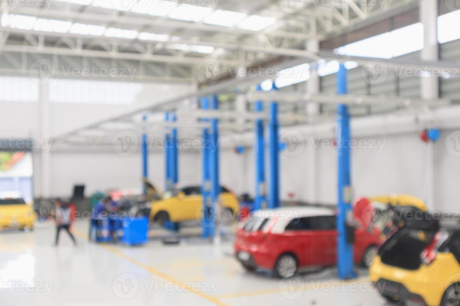 car service centre with auto at repair station bokeh light defocused blur background photo