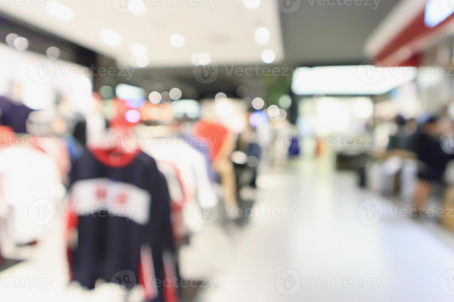 Abstract blur clothing boutique display interior of shopping mall background photo