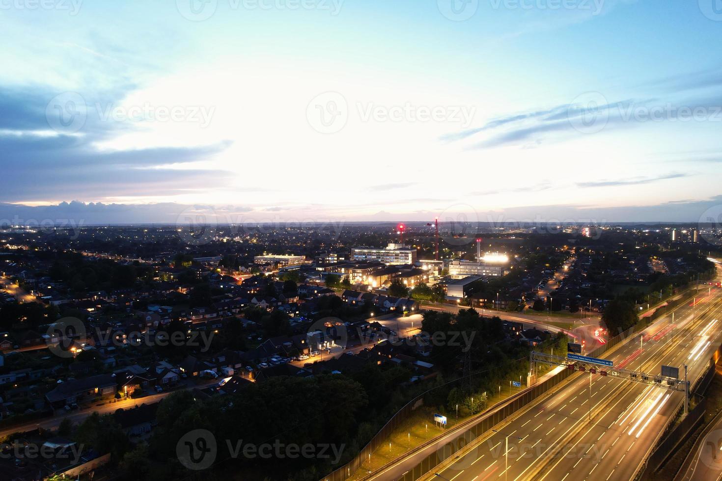 High Angle View of British Motorways with Traffic. The Aerial footage of British Roads and Motorways at between M1 Junction 7 and 9 at Sunset. The Footage captured on 09-07-2022 with drone's camera photo