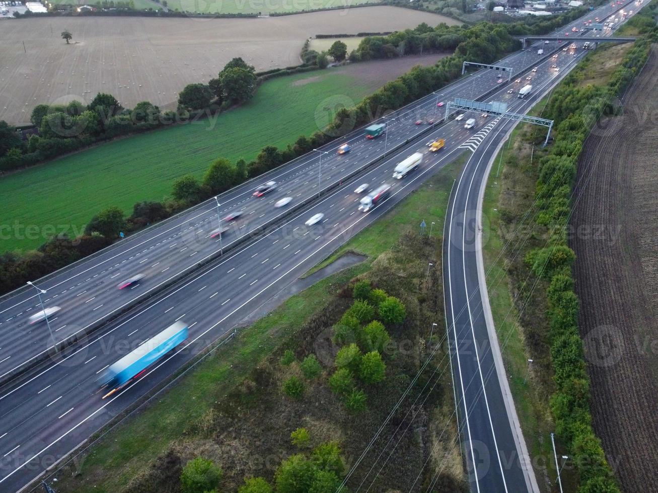 High Angle View of British Motorways with Traffic. The Aerial footage of British Roads and Motorways at between M1 Junction 7 and 9 at Sunset. The Footage captured on 09-07-2022 with drone's camera photo