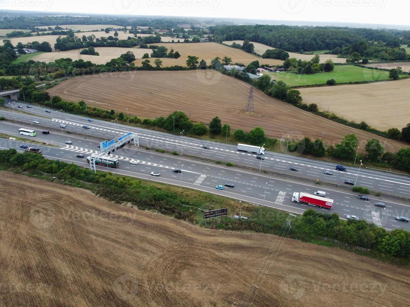 High Angle View of British Motorways with Traffic. The Aerial footage of British Roads and Motorways at between M1 Junction 7 and 9 at Sunset. The Footage captured on 09-07-2022 with drone's camera photo