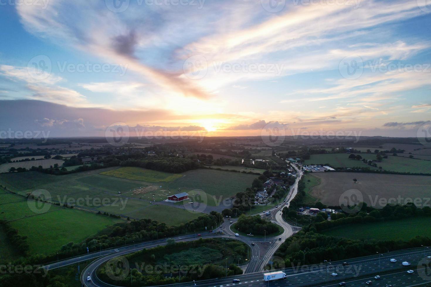 High Angle View of British Motorways with Traffic. The Aerial footage of British Roads and Motorways at between M1 Junction 7 and 9 at Sunset. The Footage captured on 09-07-2022 with drone's camera photo