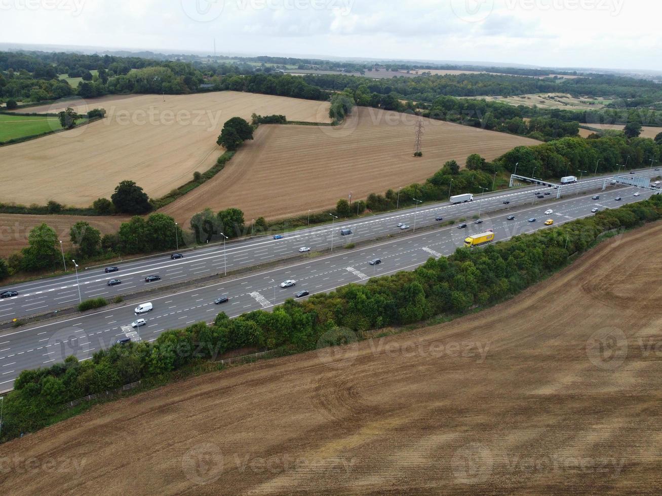 High Angle View of British Motorways with Traffic. The Aerial footage of British Roads and Motorways at between M1 Junction 7 and 9 at Sunset. The Footage captured on 09-07-2022 with drone's camera photo