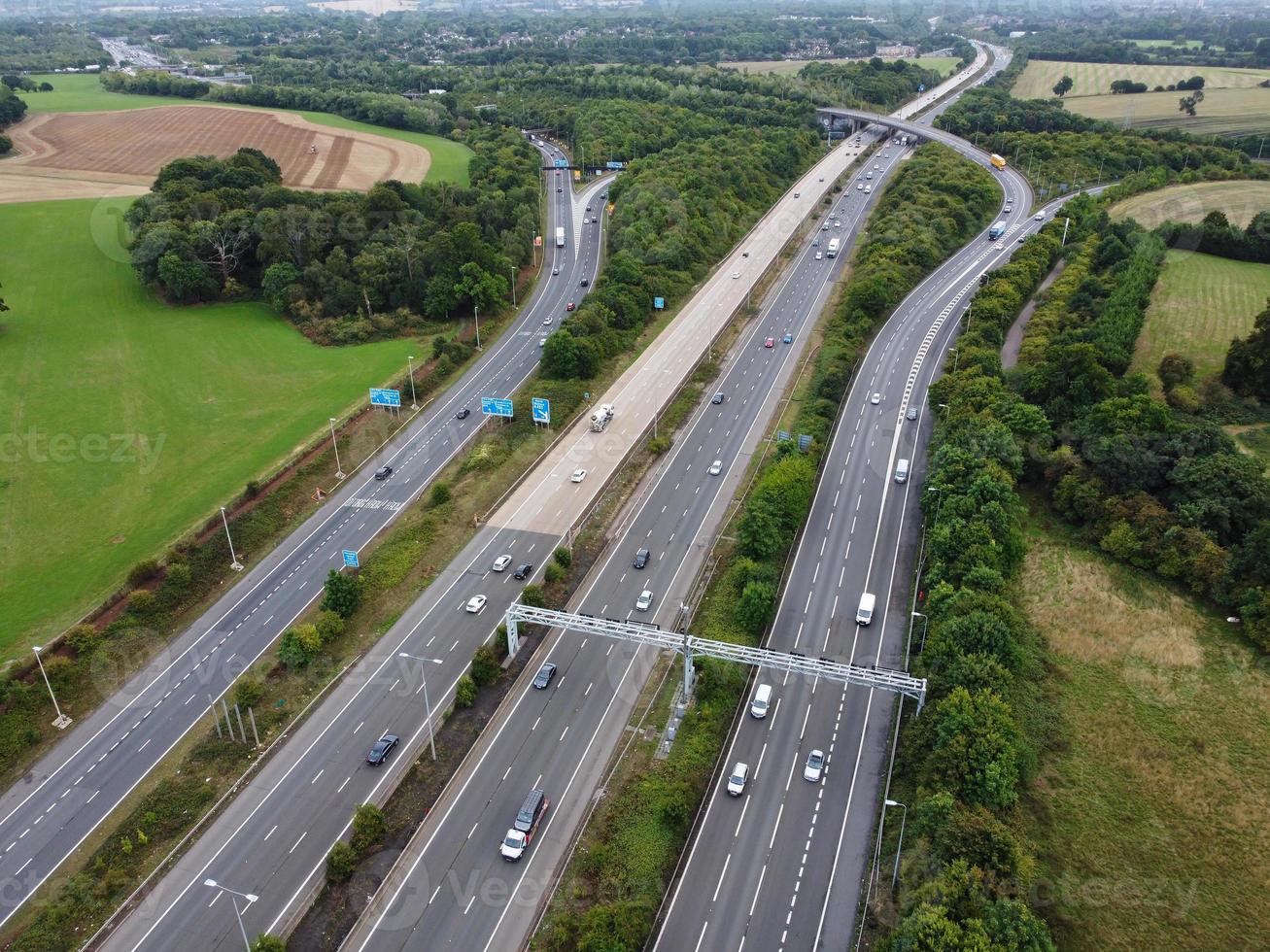 High Angle View of British Motorways with Traffic. The Aerial footage of British Roads and Motorways at between M1 Junction 7 and 9 at Sunset. The Footage captured on 09-07-2022 with drone's camera photo