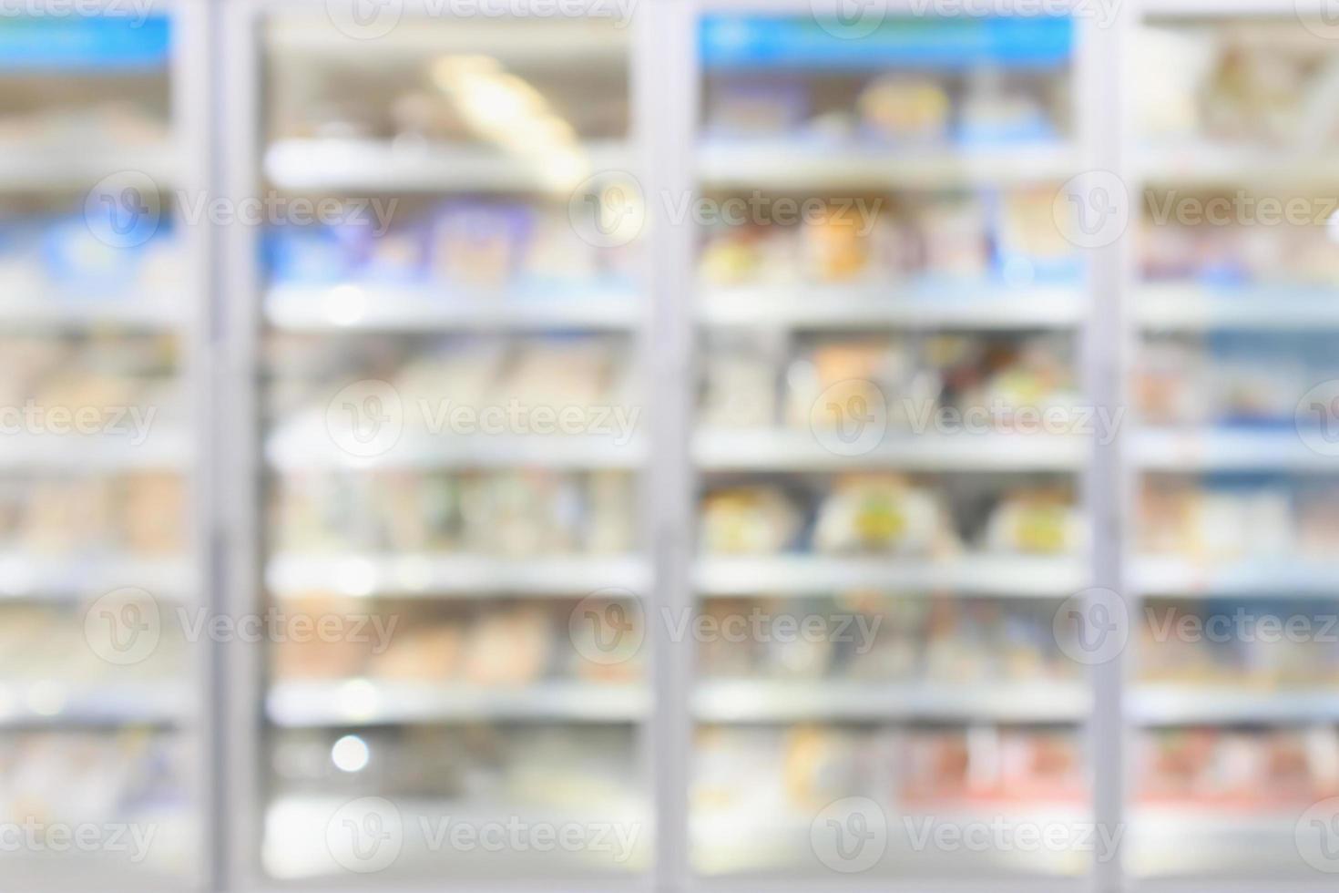 supermarket commercial refrigerators freezer showing frozen foods abstract blur background photo