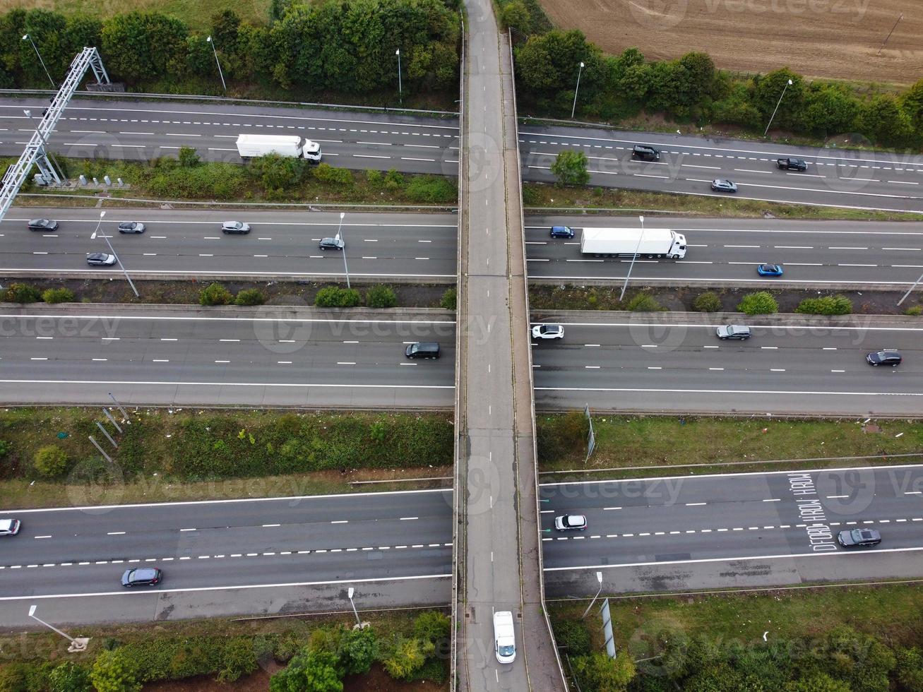 High Angle View of British Motorways with Traffic. The Aerial footage of British Roads and Motorways at between M1 Junction 7 and 9 at Sunset. The Footage captured on 09-07-2022 with drone's camera photo