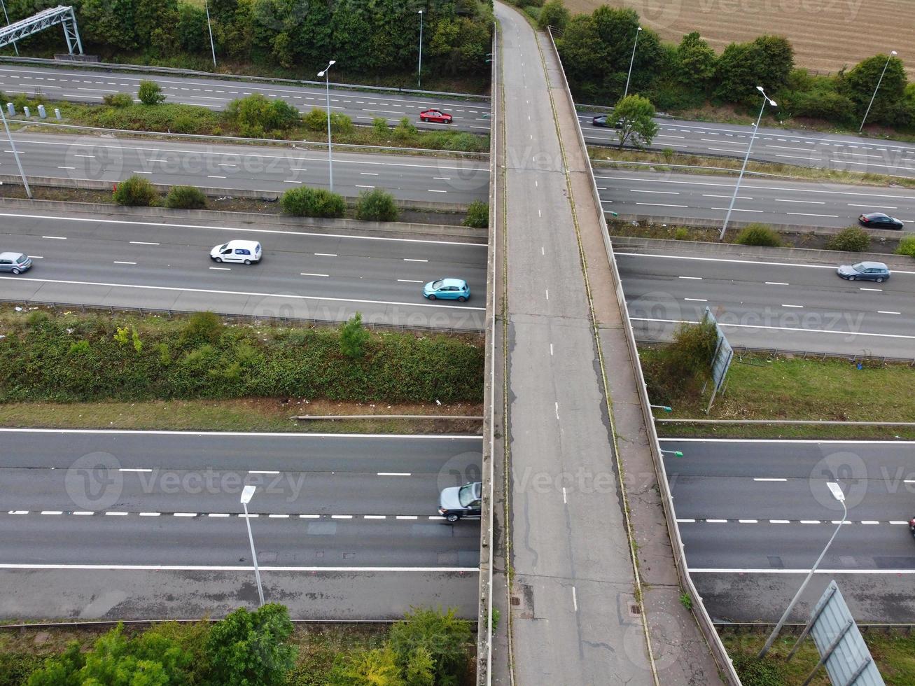 High Angle View of British Motorways with Traffic. The Aerial footage of British Roads and Motorways at between M1 Junction 7 and 9 at Sunset. The Footage captured on 09-07-2022 with drone's camera photo