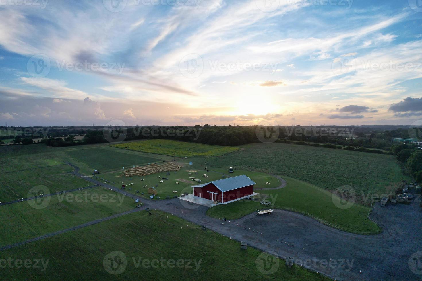 High angle view of cows grazing on field against sky. Gorgeous high angle aerial view of Animal Farm at British Agricultural Field Near London England Great Britain of UK photo