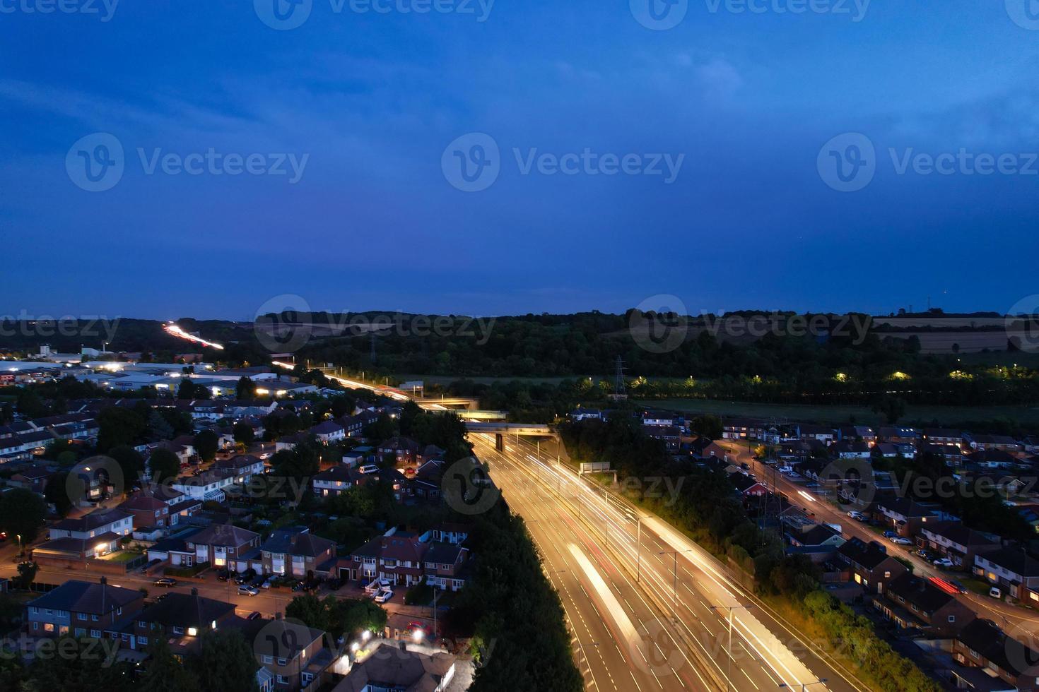 High Angle View of British Motorways with Traffic. The Aerial footage of British Roads and Motorways at between M1 Junction 7 and 9 at Sunset. The Footage captured on 09-07-2022 with drone's camera photo