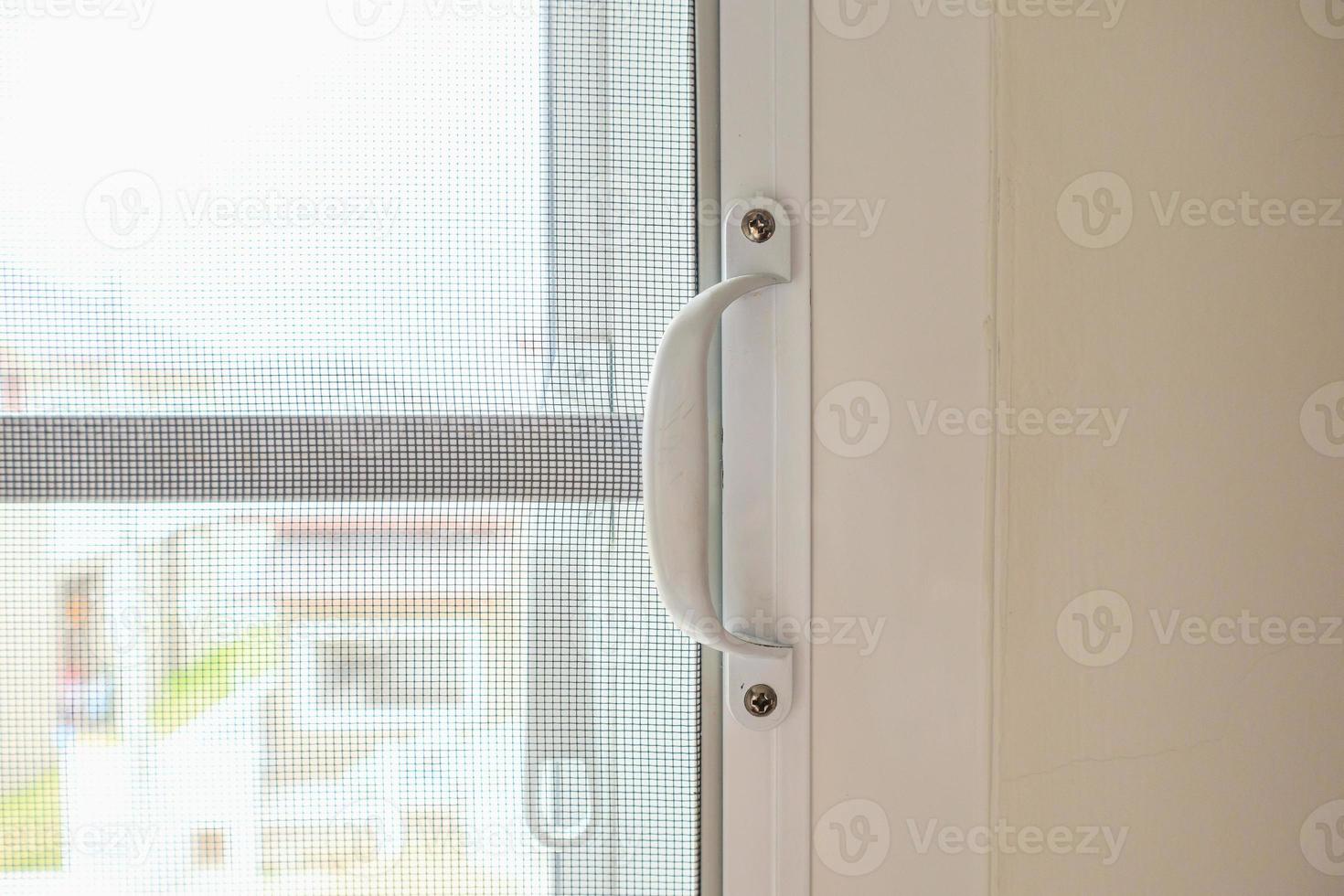 mosquito net wire screen on house window protection against insect photo