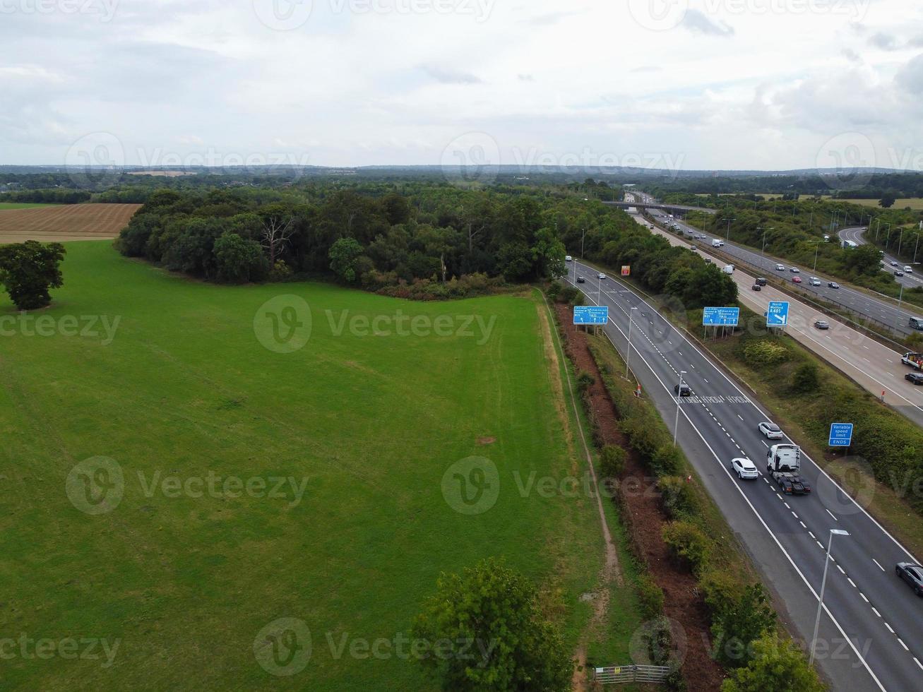 High Angle View of British Motorways with Traffic. The Aerial footage of British Roads and Motorways at between M1 Junction 7 and 9 at Sunset. The Footage captured on 09-07-2022 with drone's camera photo