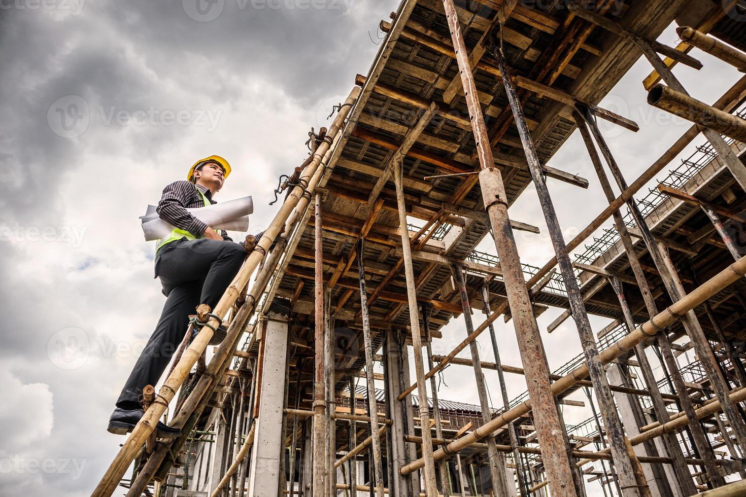 professional engineer worker at the house building construction site photo