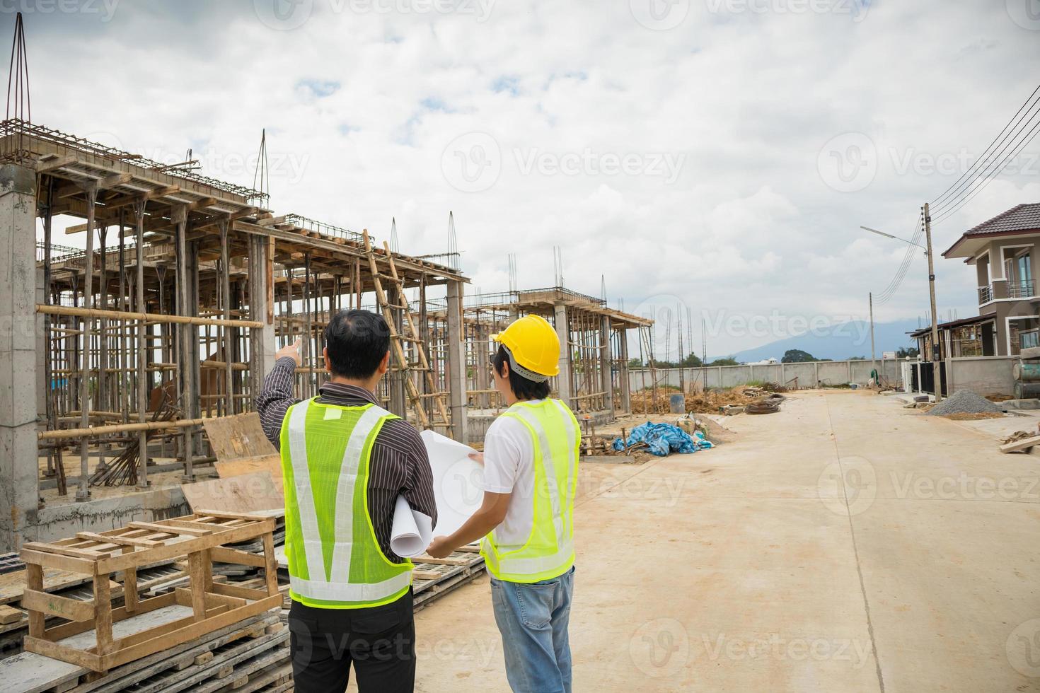 Asian business man construction engineer workers at house building site photo