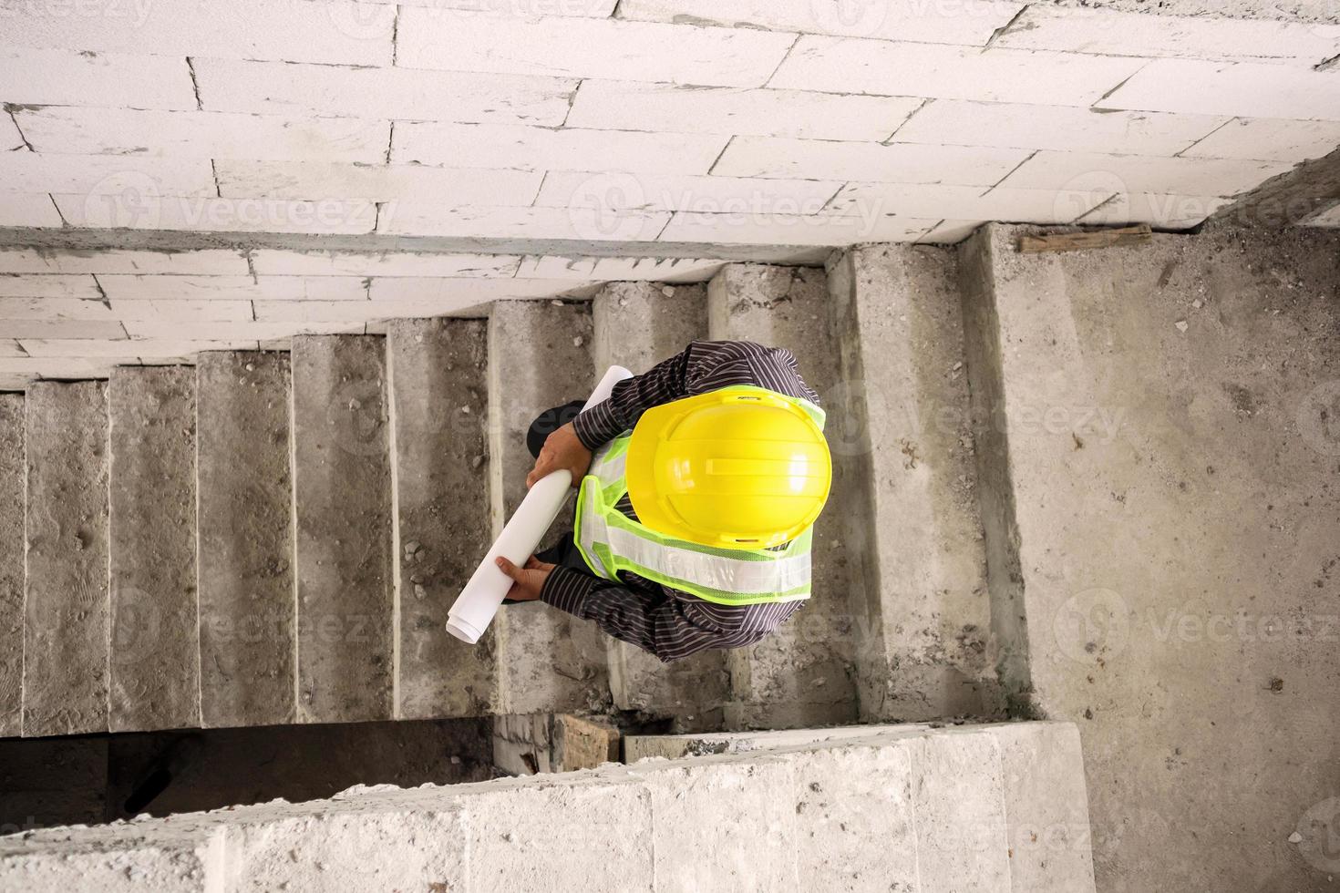 professional engineer worker at the house building construction site photo