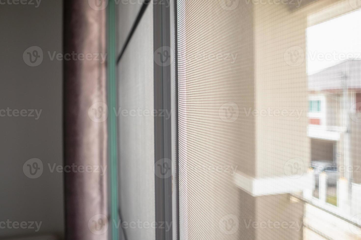 mosquito net wire screen on house window protection against insect photo