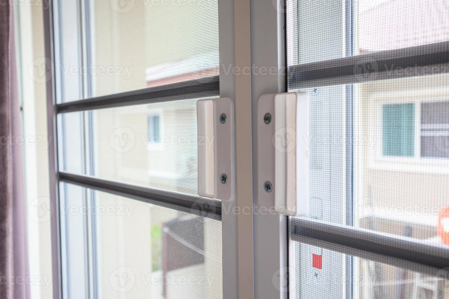 mosquito net wire screen on house window protection against insect photo