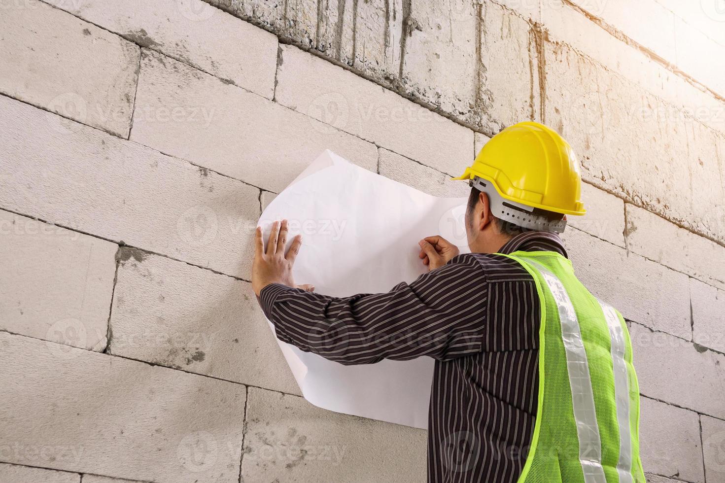 professional engineer worker at the house building construction site photo