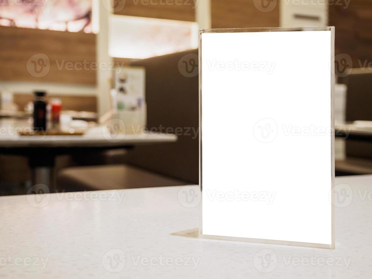 Mock up menu frame on table in the cafe restaurant photo