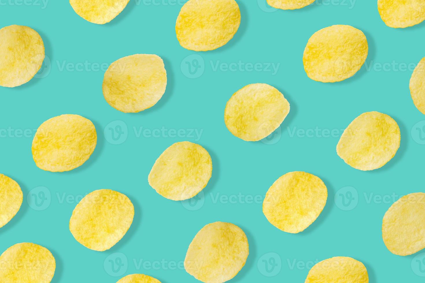 Potato chips pattern on pastel blue background top view flat lay photo