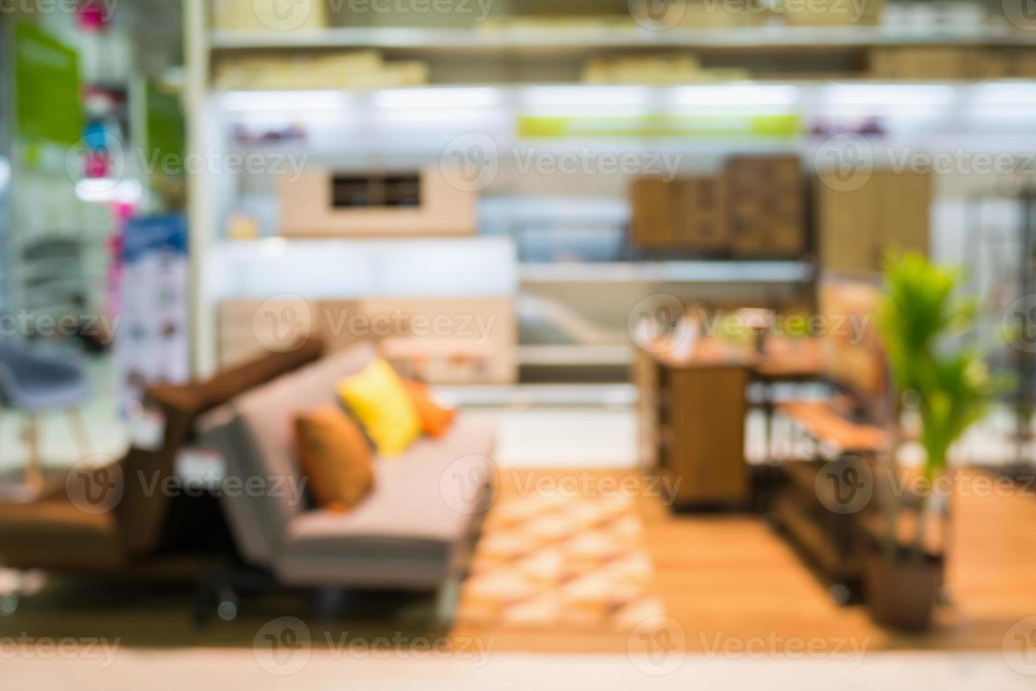 Abstract blur sofa in furniture showroom store interior with bokeh light background for montage product display photo