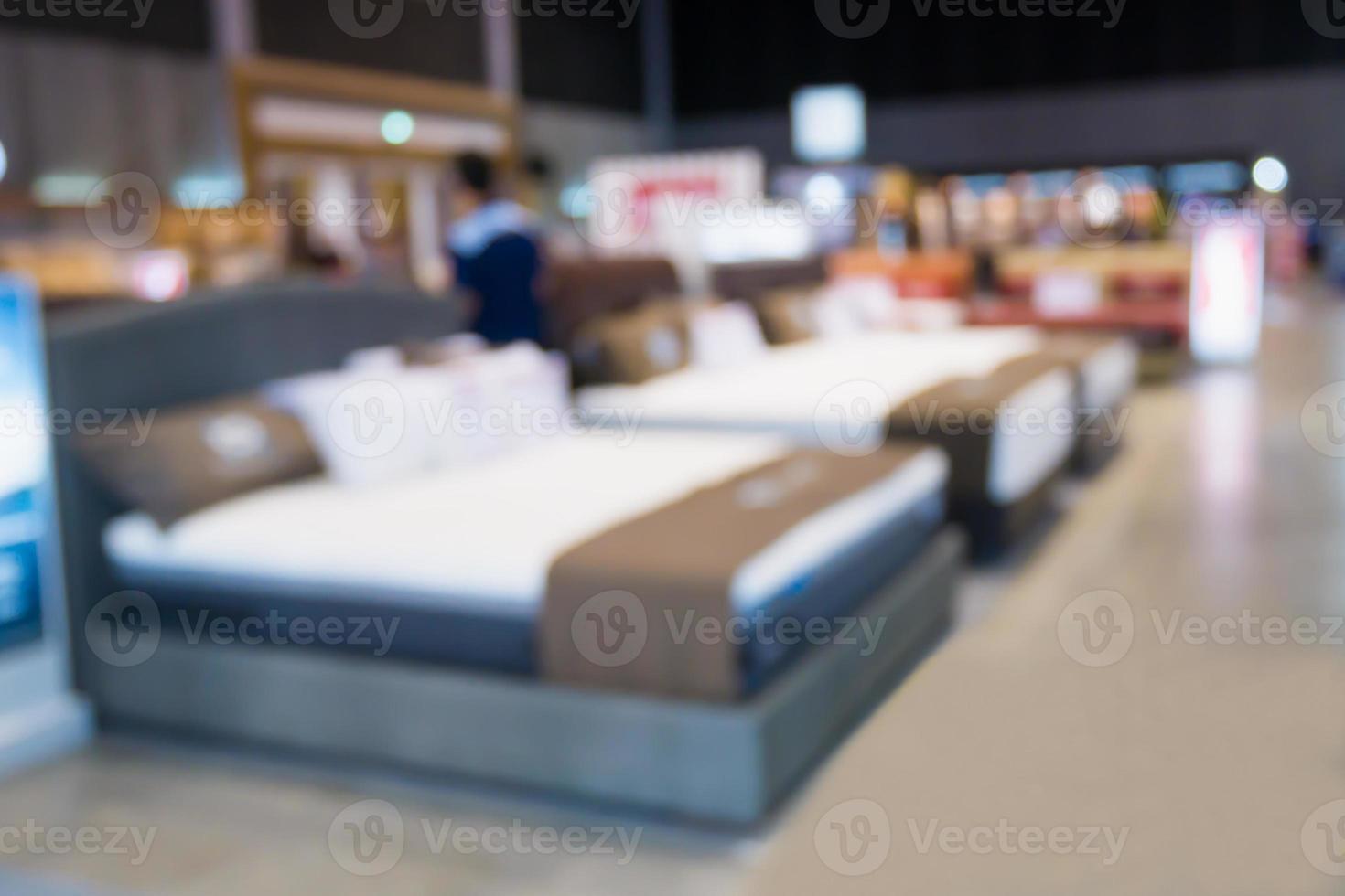 Abstract blurred bed show in furniture home and decor store background photo