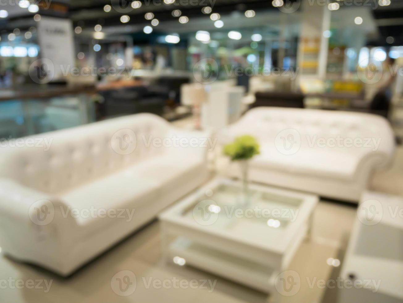 Abstract blur sofa in furniture store shop interior background for