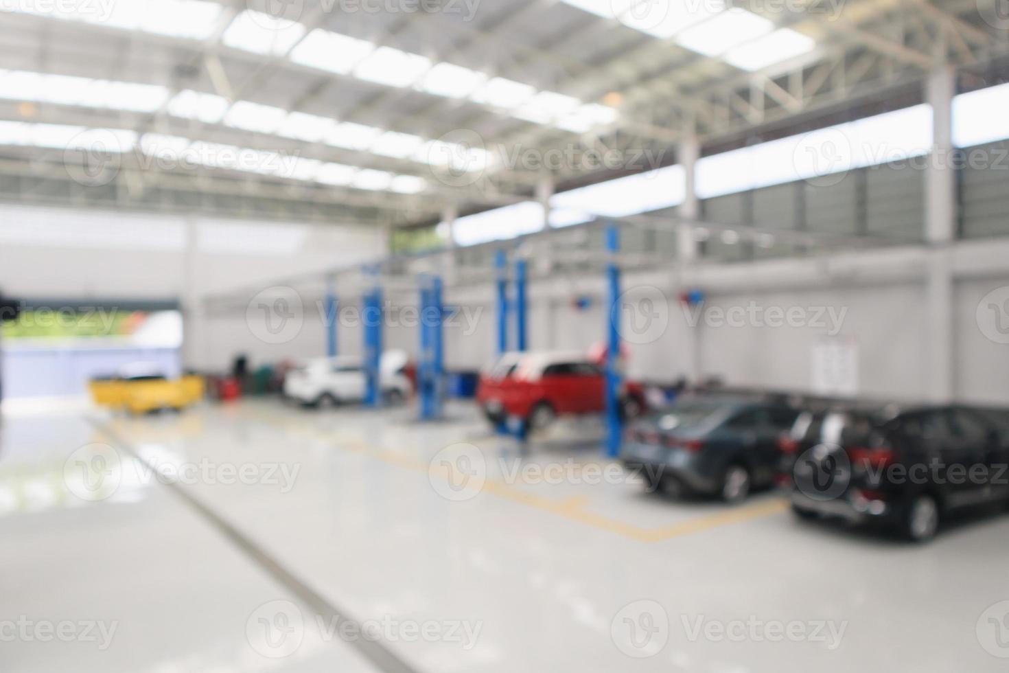 car service centre with auto at repair station bokeh light defocused blur background photo