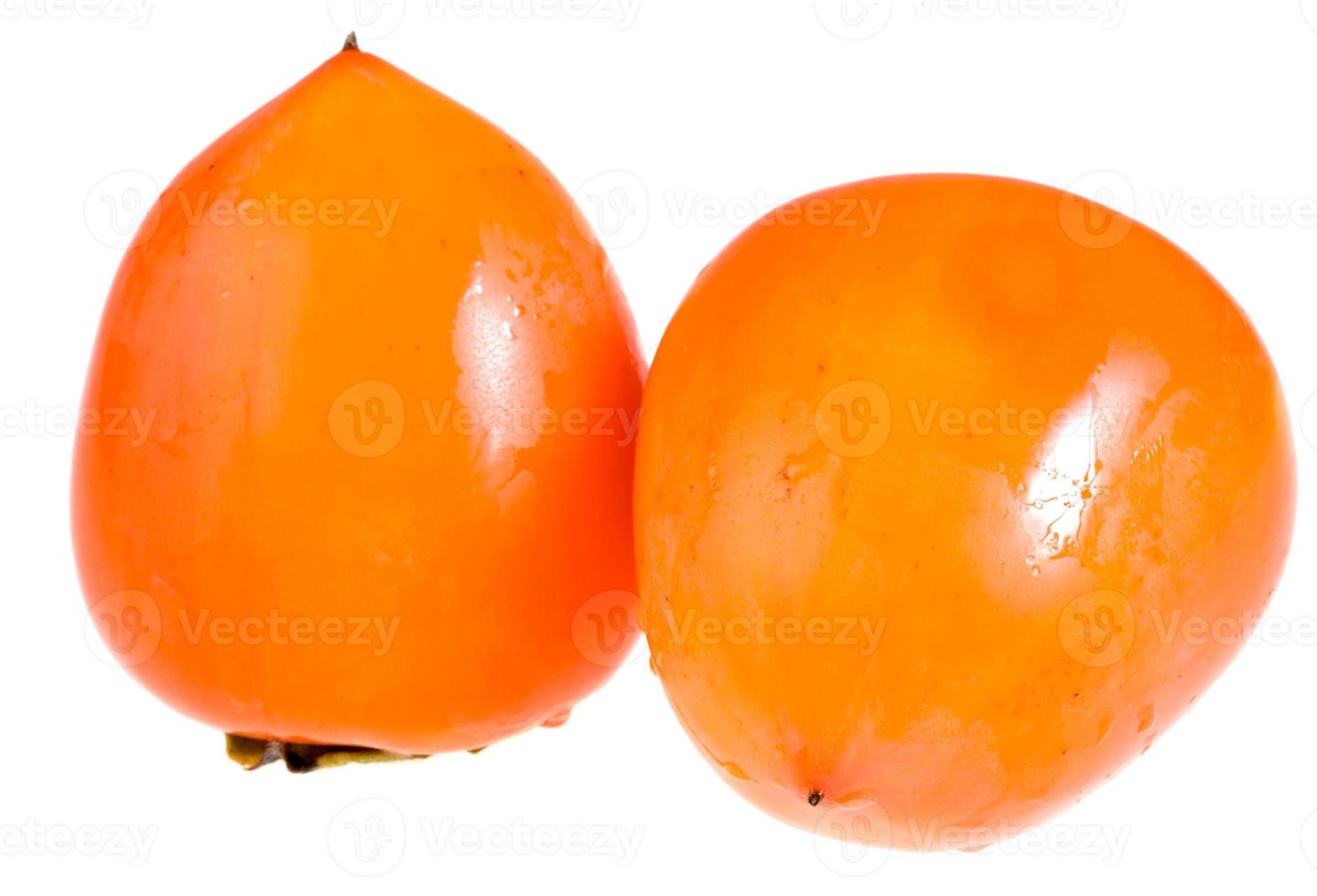 two ripe persimmons isolated photo