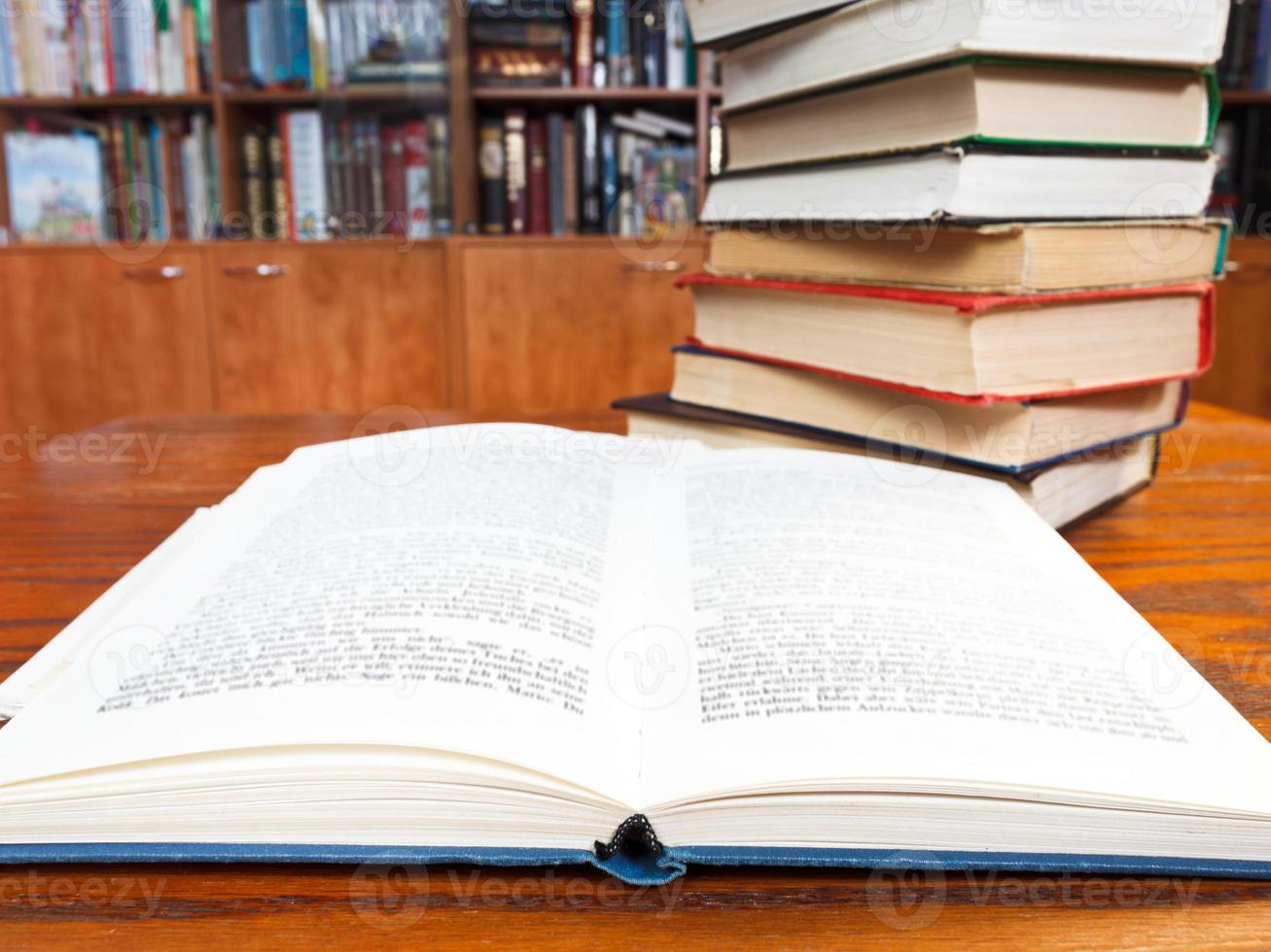 open book on wooden table photo