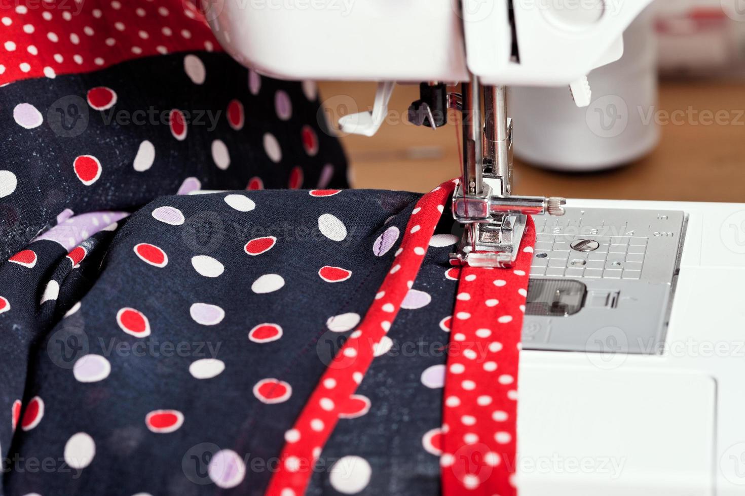 sewing dress on machine photo