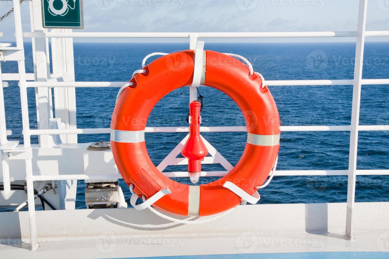 red life buoy on side of cruise liner photo