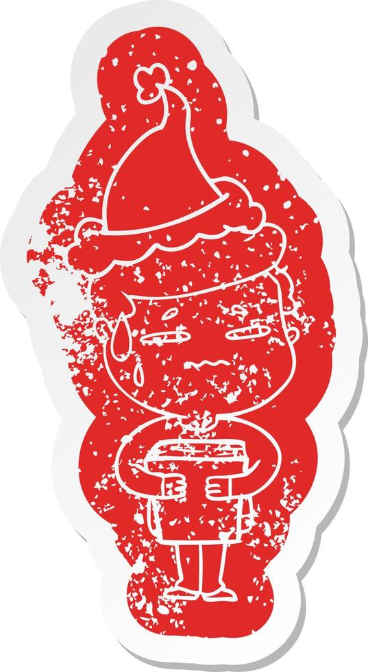 cartoon distressed sticker of a anxious boy carrying book wearing santa hat vector