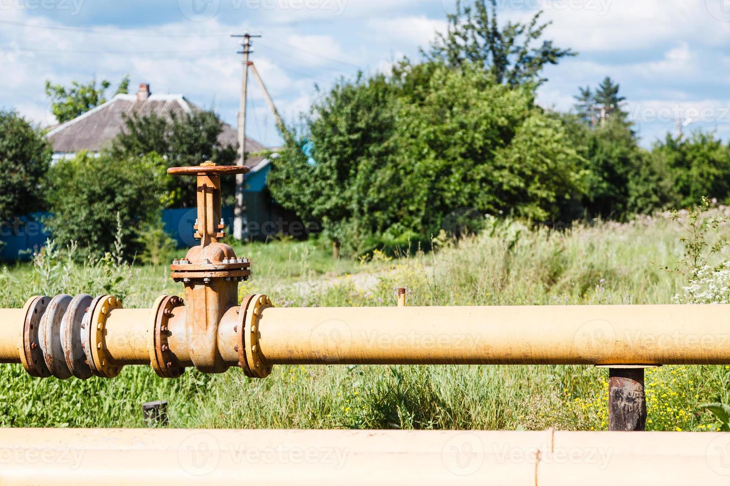 gas pipeline in village in summer day photo