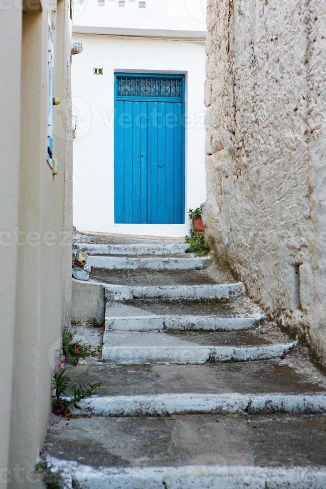 Narrow and colorful street in the village of Kritsa in the island of Crete photo