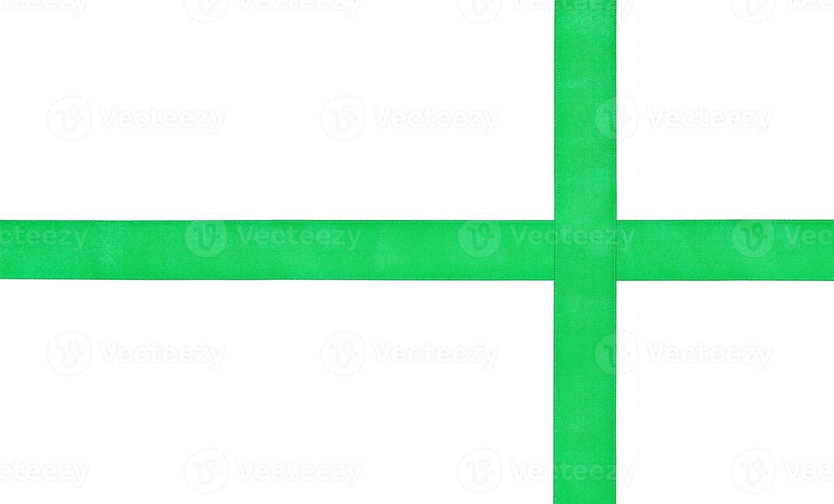two crossing green silk strips isolated on white photo