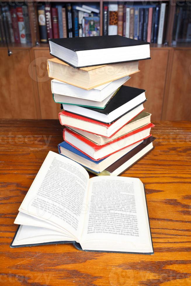 open books on wooden table photo