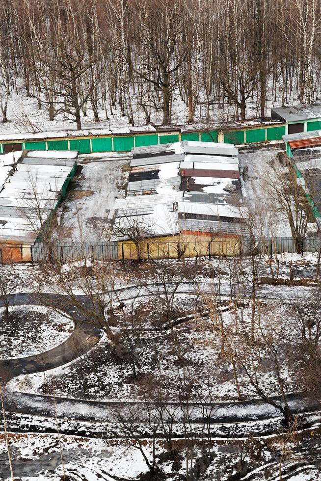 snowy footpath and vehicle sheds photo