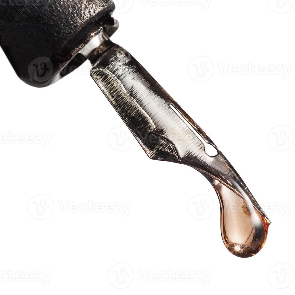 macro view of drop liquid on tip of pen photo