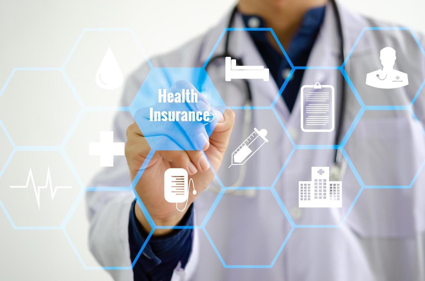 Doctor touching icon health care insurance medical on virtual screen concept. photo