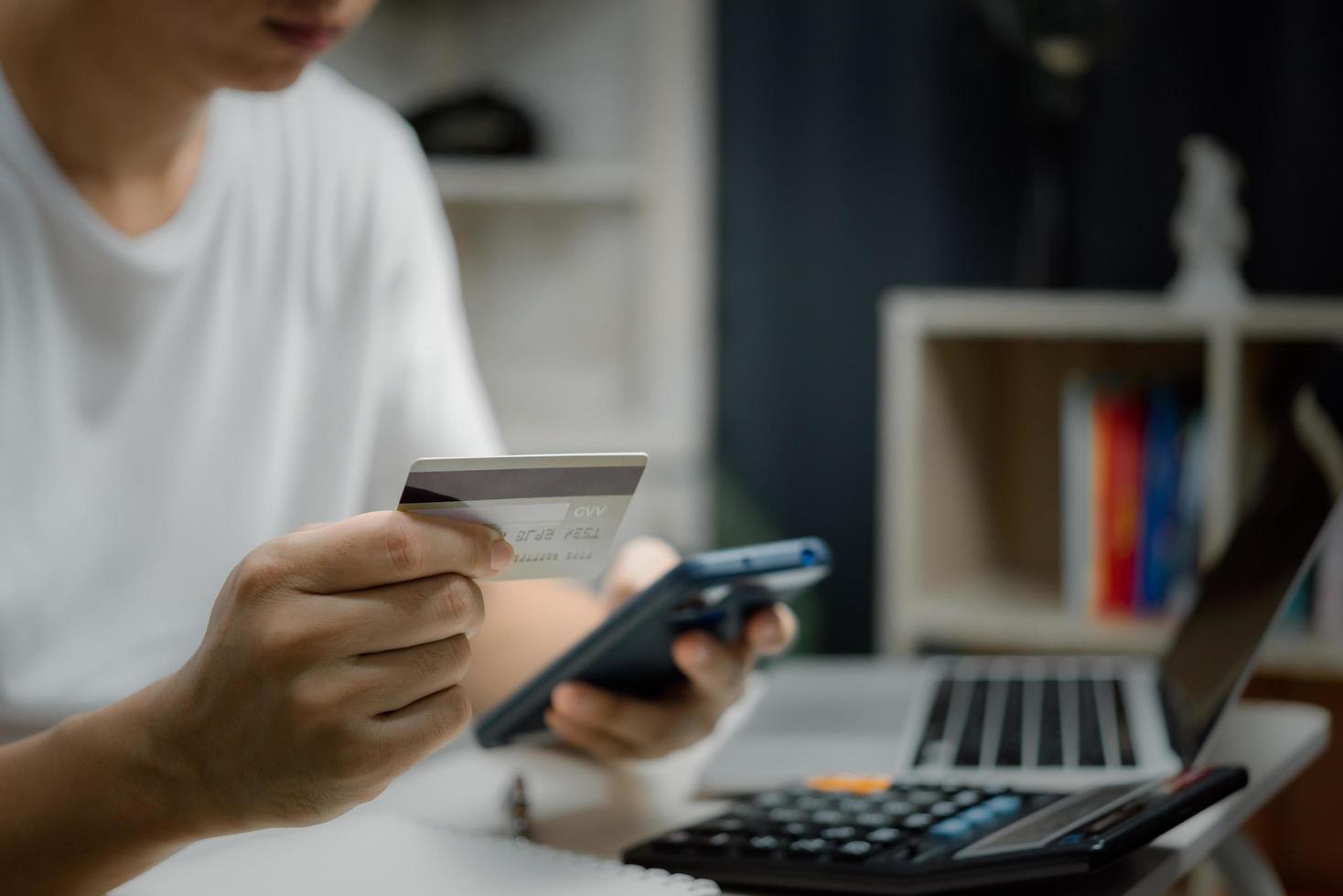 business finance payment digital technology online commerce banking concept Man holding credit card paying and shopping with money transfer. photo